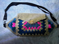 hand crocheted fanny light beige. Button flap. Adjustible waist belt with slider, d-ring and hook. Roomy and comfortable to wear.